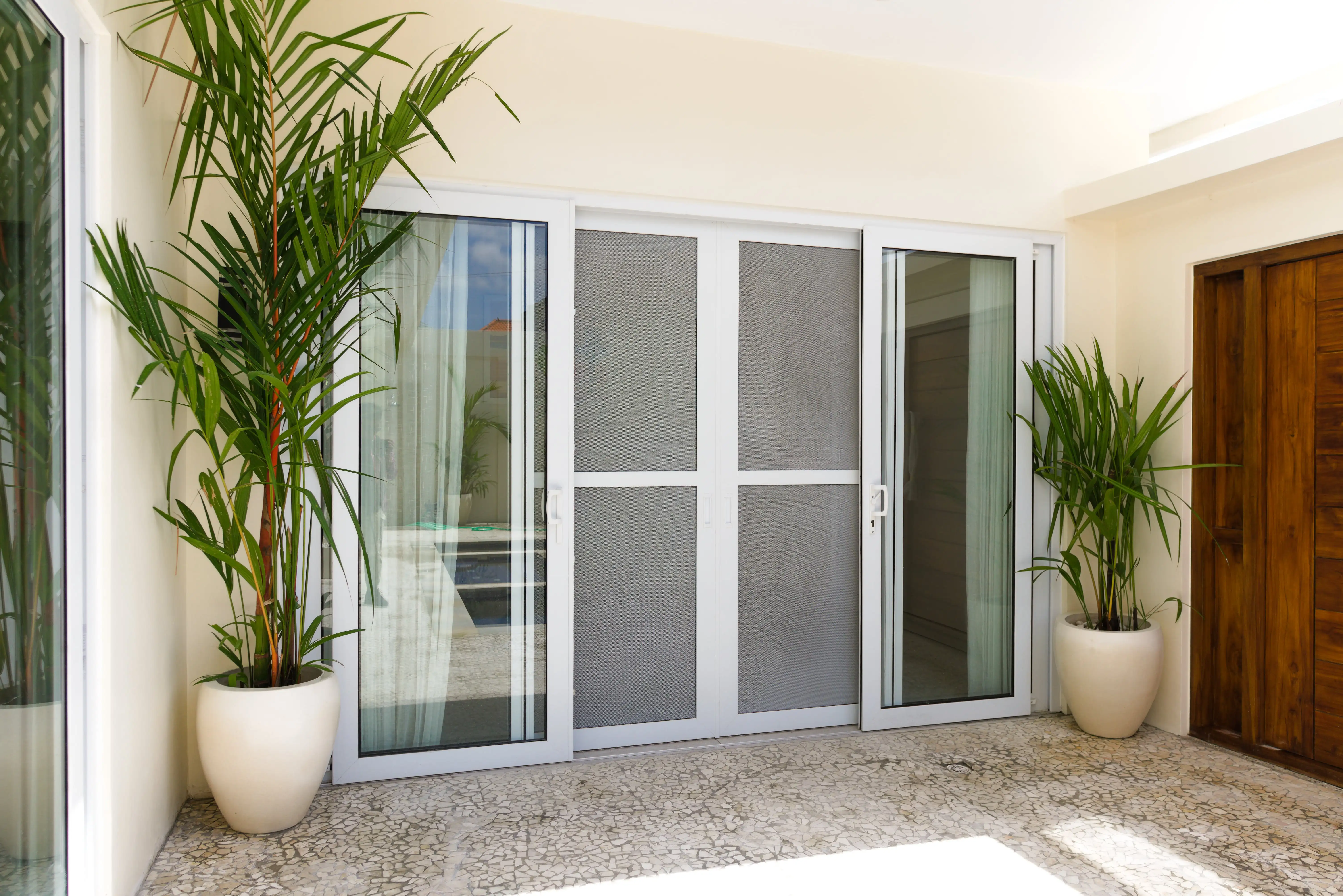 Sliding Door dengan Kasa Nyamuk UPVC Bali Solution